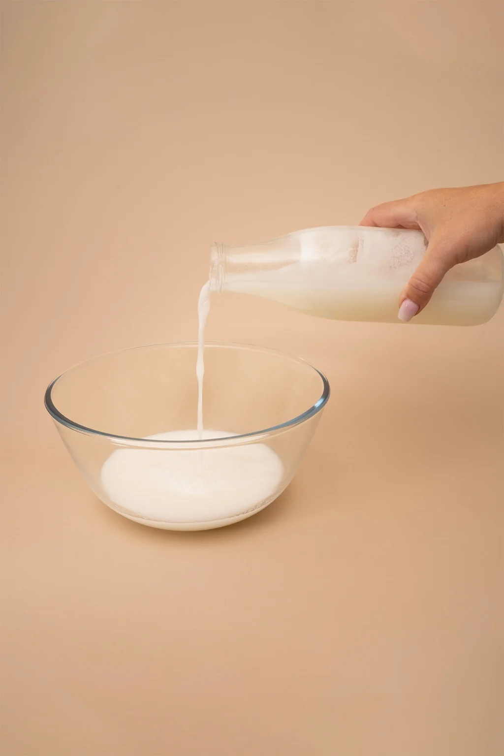 A glass bottle filled with fresh milk